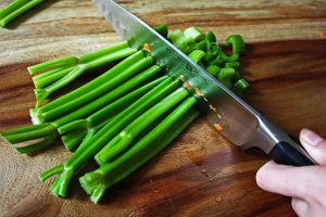 Celery prep for black bean vegetable soup with avocado