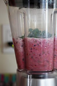Blending a Berry Banana Smoothie with Almond Milk