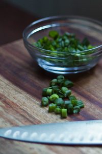 Chopped green onions, ready to garnish the brown rice and kidney beans