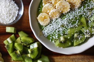 Tropical Green Smoothie Bowl with Pineapple, Mango, Kiwi, Banana, and Spinach